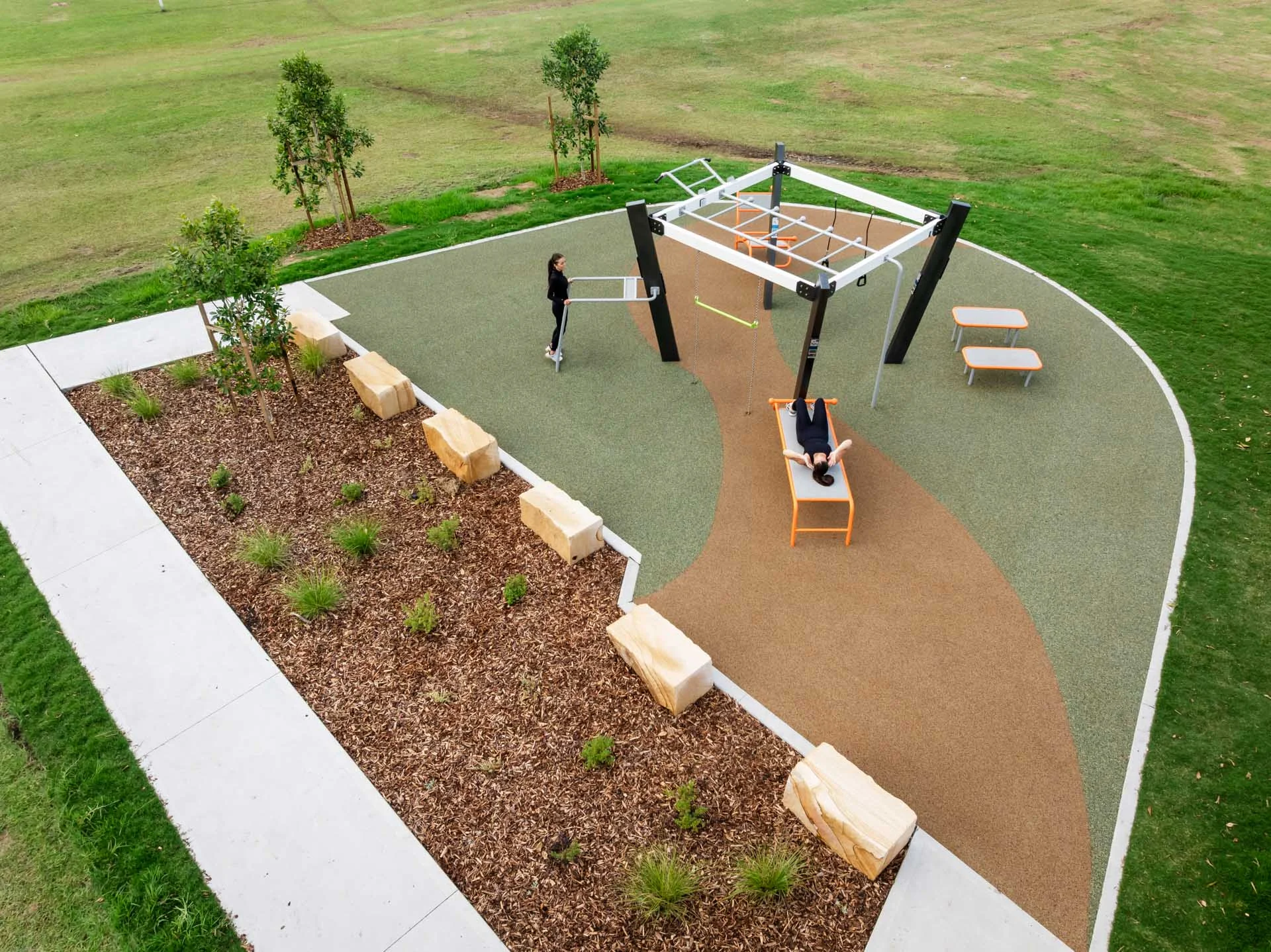 Outdoor fitness equipment in a public recreation space